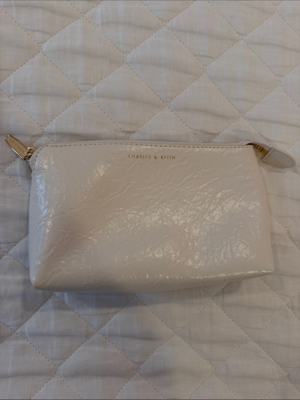 Charles & Keith Cream Quilted Glossy Cosmetic Pouch